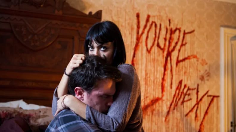 Wendy Glenn and the late Nicholas Tucci embrace in a scene from