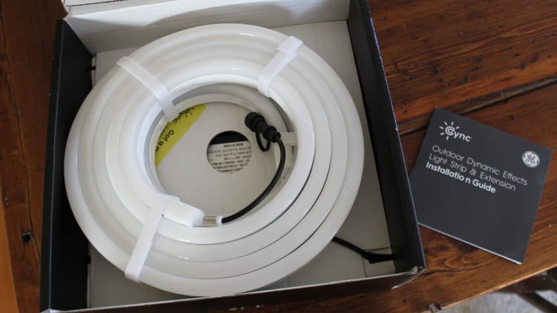 Roll of GE Cync Lights in box packaging on table indoors.
