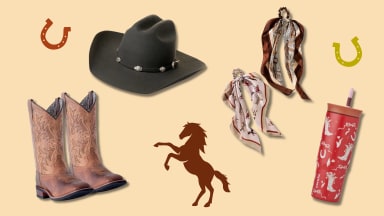 A cowboy core flat lay featuring boots, a felt hat, patterned scarves, and a western-style tumbler with horse and horseshoe accents.