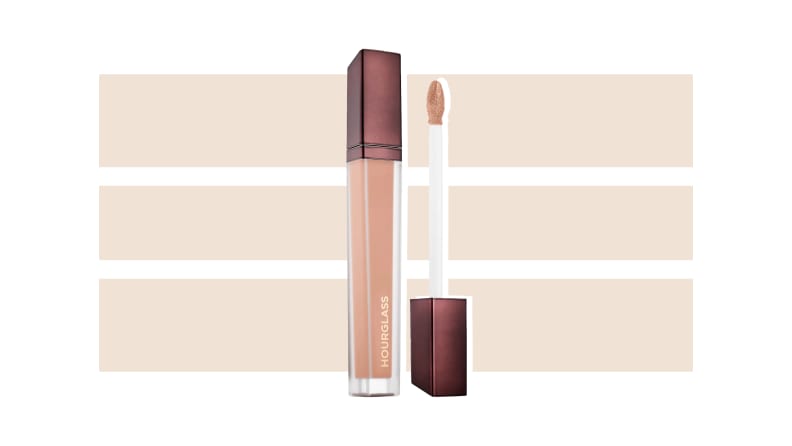 Hourglass Cosmetics Vanishing Concealer against a beige and white background.