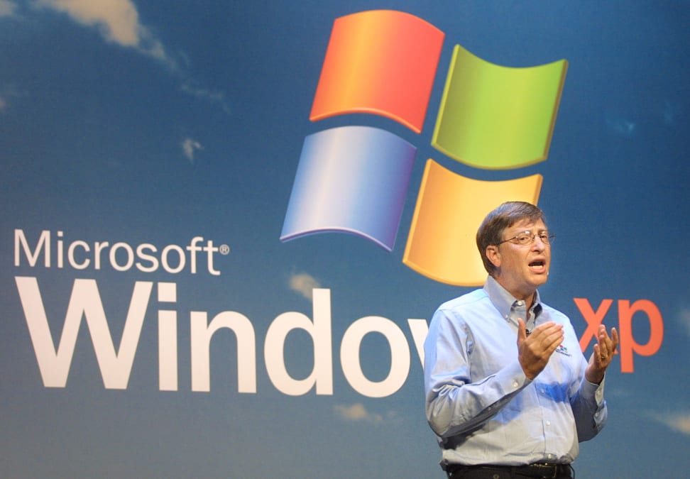 Bill gates speaks at the unveiling of Windows XP, a super old operating system you should stop using