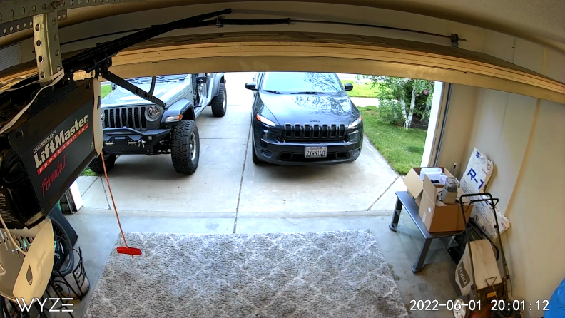 Camera feed of a garage.