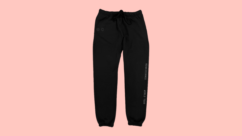 A pair of sweatpants that are printed with the words "Renaissance World Tour.