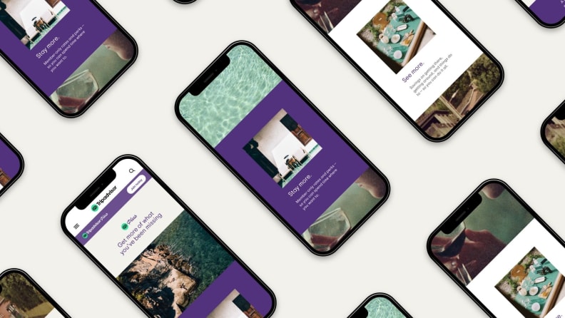 Mobile phones displaying the Tripadvisor Plus app are arranged diagonally