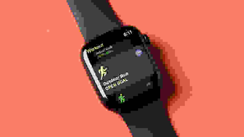 An Apple Watch Series 8 sits against an orange background