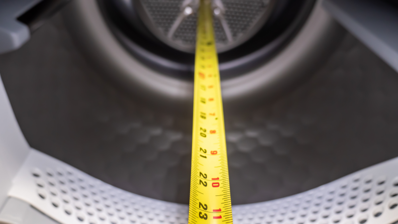 Internal view of the Miele dryer shown with a measuring tape.