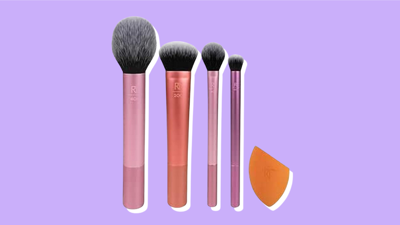 A makeup brush set on a purple background.