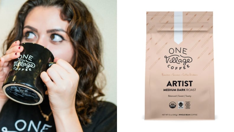 A woman drinks coffee from a mug. A bag of One Village Coffee.