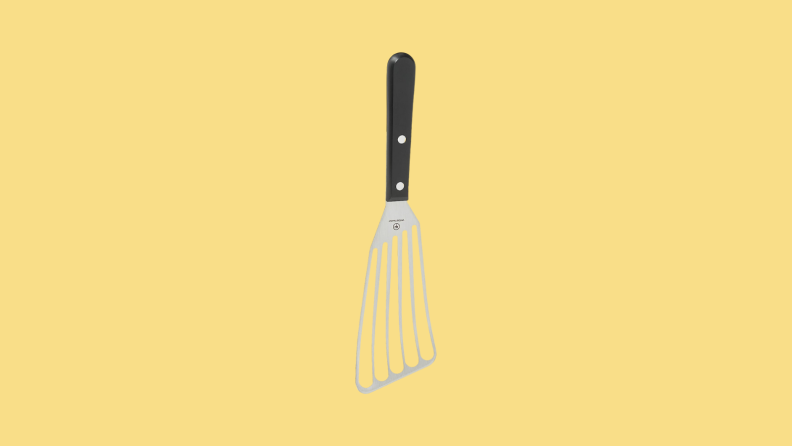 Spatula against yellow backgorund