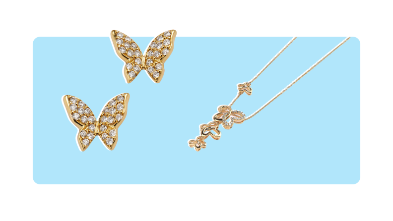 A pair of gold, diamond-encrusted butterfly stud earrings, and a gold drop necklace with a four-butterfly pendant.