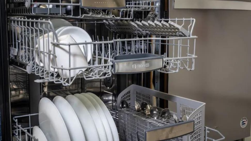A dishwasher filled with dishes.