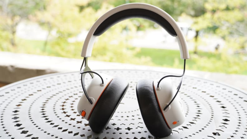 The Beyerdynamic MMX 200 headphones sitting up on a black metal table, outside.