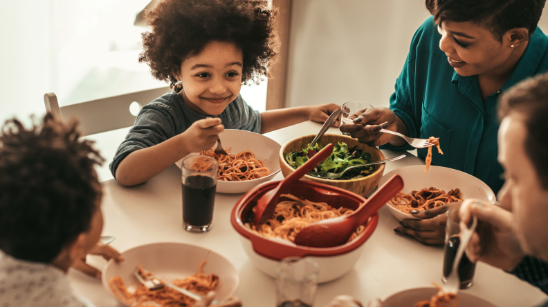 A family eating dinner together.