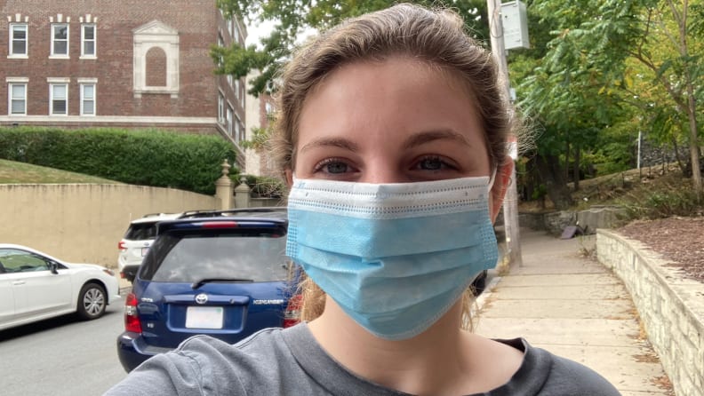 The author testing a foundation to see if it stains her face mask.