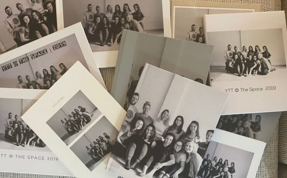 Several photo books strewn across a couch
