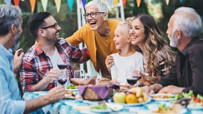 Multi-generation family having a party in the back yard