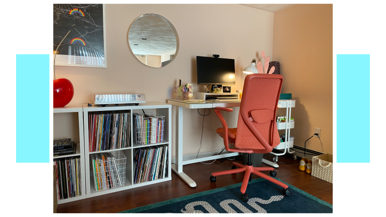 Coral colored Verve Chair stationed at desk inside of modern home office.