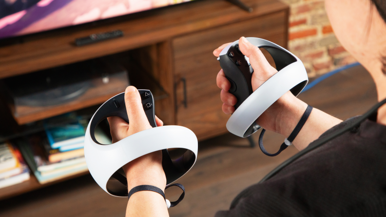 Two round VR controllers in hand