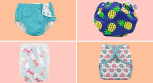 Four swim diapers sit on orange and pink checkered background