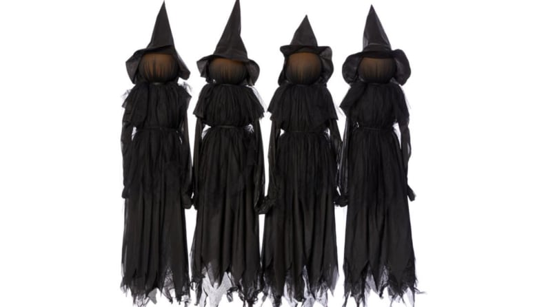 An image of a set of lawn witches in black shroud-like dresses and pointy hats.