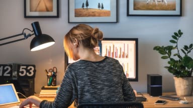 A woman using a laptop.
