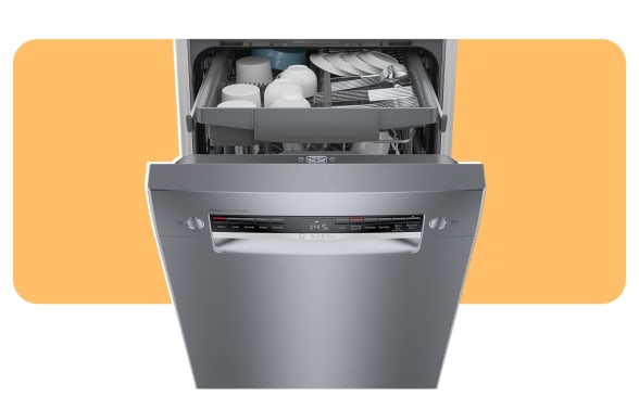 A dishwasher stands open on an orange background