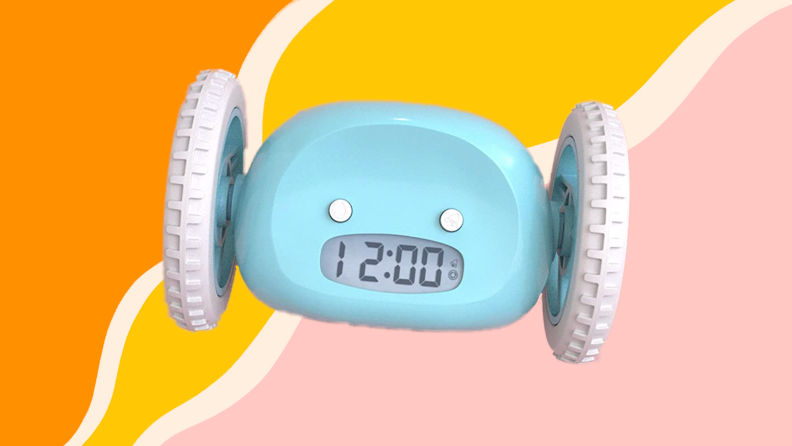 Blue alarm clock with wheels on both sides.