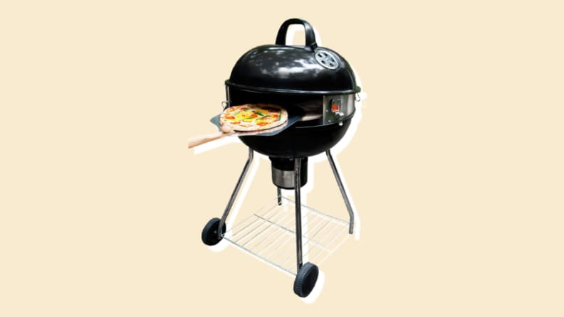 A pizza on a grill on a beige background