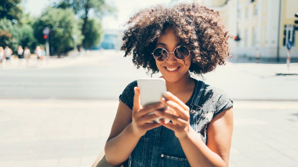 Woman looking at mobile apps on cell phone