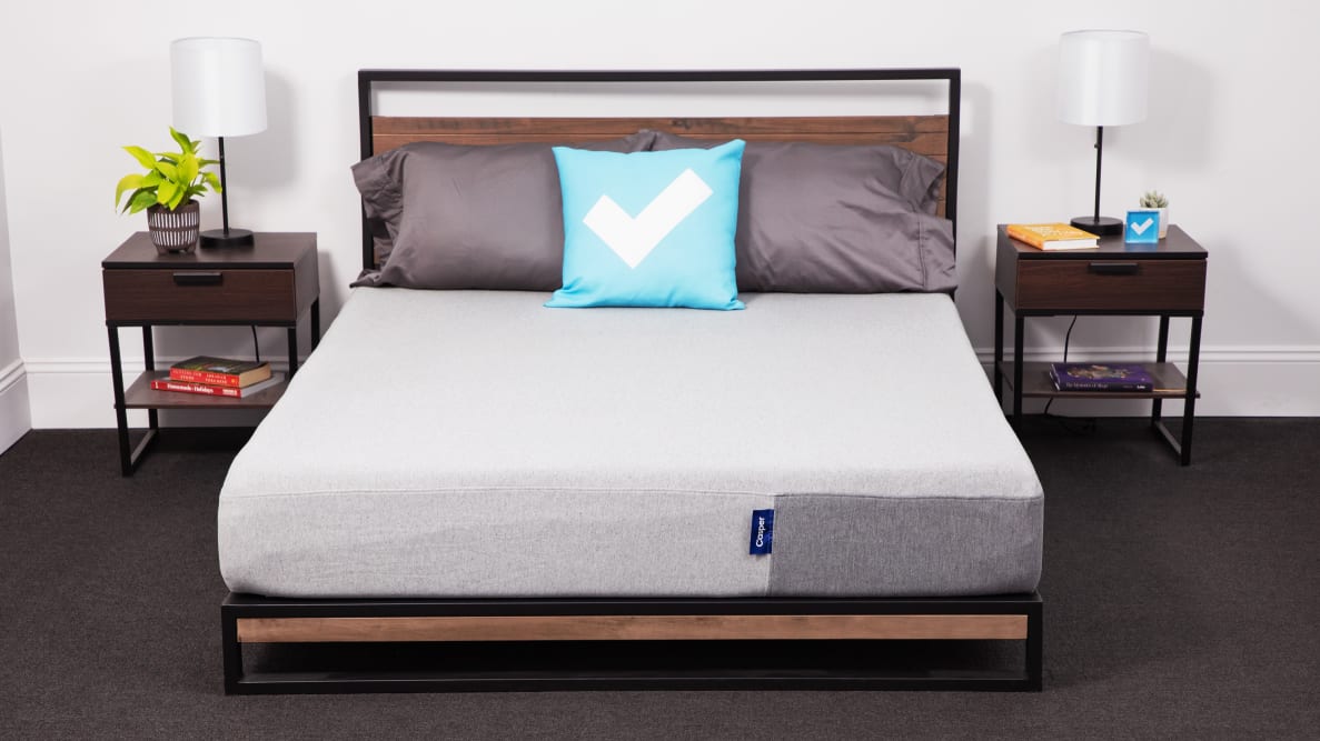 The Casper hybrid mattress in a bedroom between two nightstands