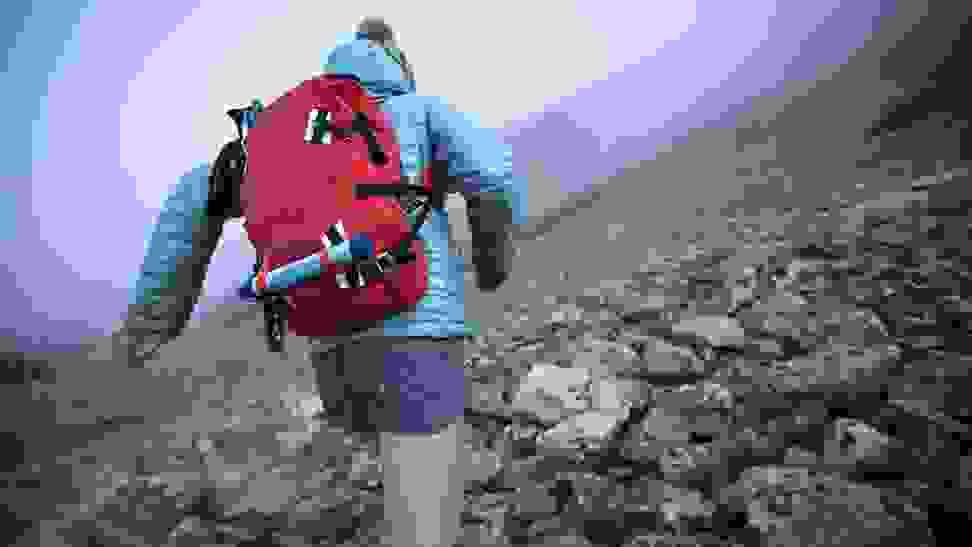 A girl hiking with her portable water filter.