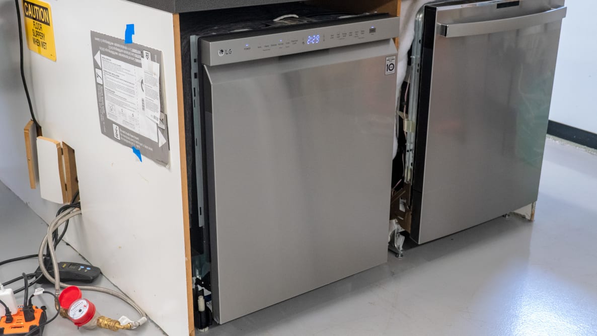 Two stainless steel dishwasher units sit adjacent to each other.