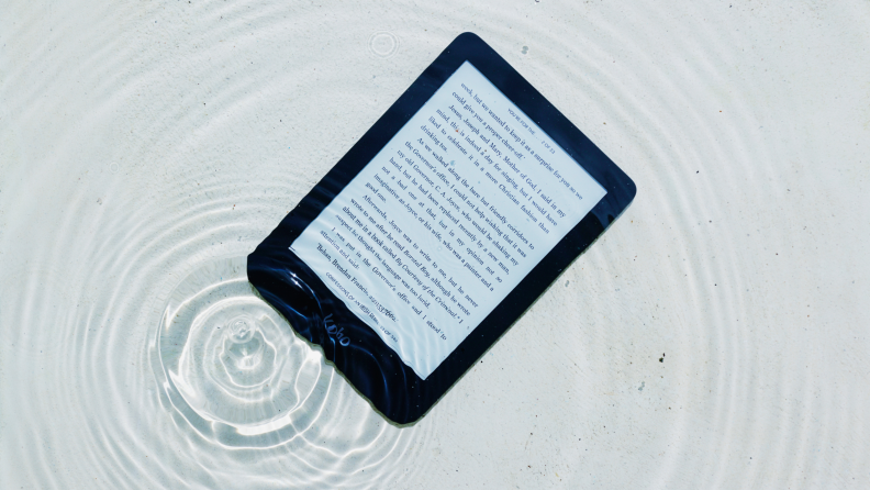 A e-reader submerged in water.