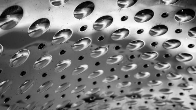 Steel bubbles on the side of the drum help scrub laundry.