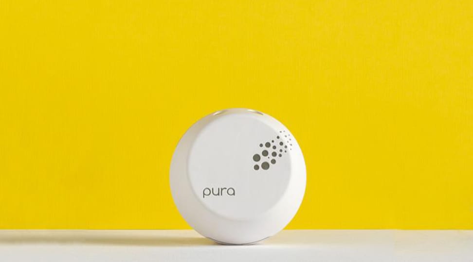 Pura smart essential oil diffuser on yellow background