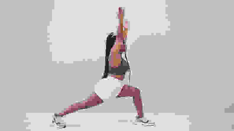 A woman in a lunge position.