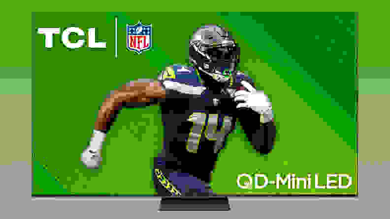 The TCL QM7 mini-LED TV displaying a professional football player in front of a plain, colorful background