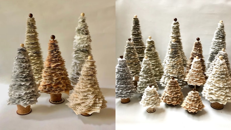 Small paper Christmas trees lined up.