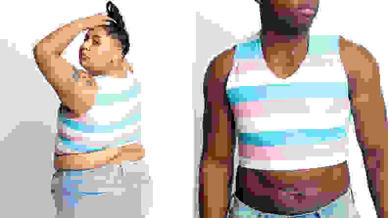 A plus-size person looking over their shoulder wearing a trans-flag-colored binder and denim pants, next to a muscular person wearing a trans-flag-colored binder.
