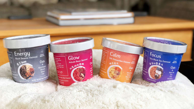 Four Crave Natural oatmeals are on display. From the left, there's Black Sesame, Adzuki Bean, Silk Osmanthus, and Taro Black Tea Oatmeals.