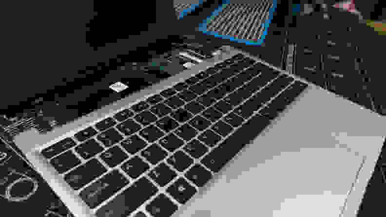 The keyboard and touchpad lay atop the bare processor board.