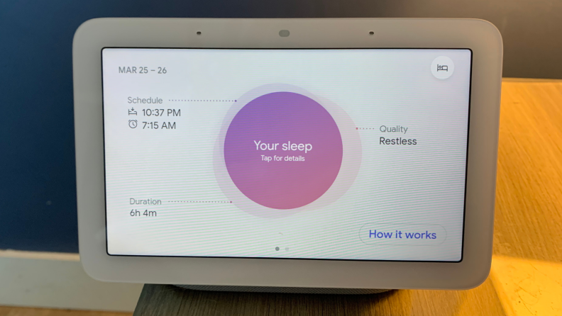 Google's Nest Hub (second-gen) smart display sits on a nightstand.