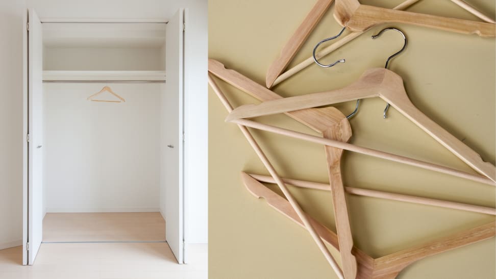 An empty closet next to a pile of empty hangers