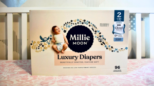 Millie Moon luxury diapers box inside a crib.