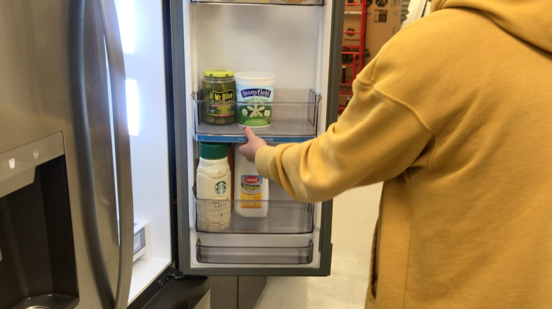 A short video in which one of our lab technicians in a yellow sweatshirt showcases how the Click & Glide door bin slides up and down.