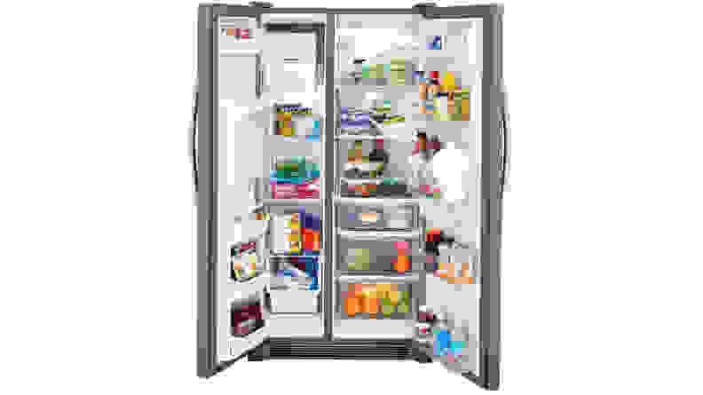 The Frigidaire FFSS2615TS side-by-side refrigerator with both doors flung open, filled to the brim with groceries.