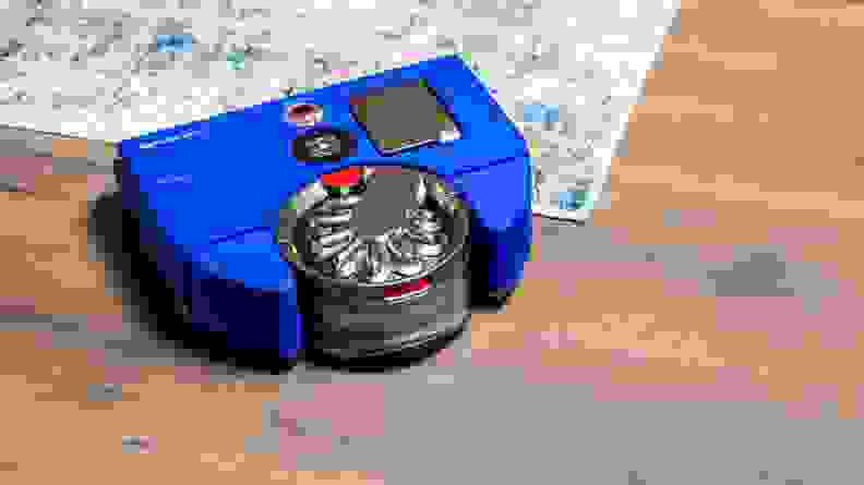 Dyson 360 visnav on the corner of a blue gradient carpet