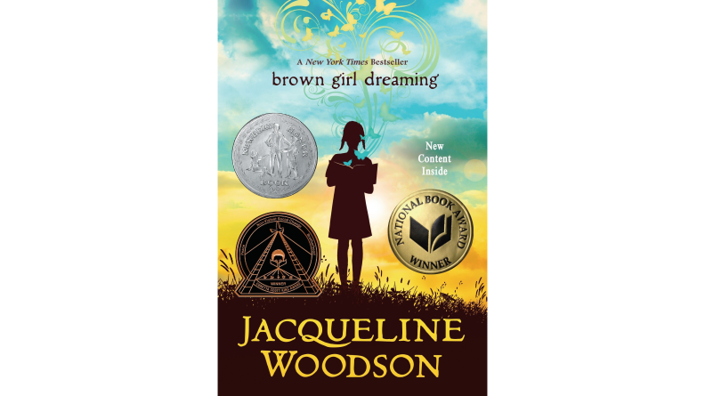 The cover of Brown Girl Dreaming showing the silhouette of a young girl standing in a field.