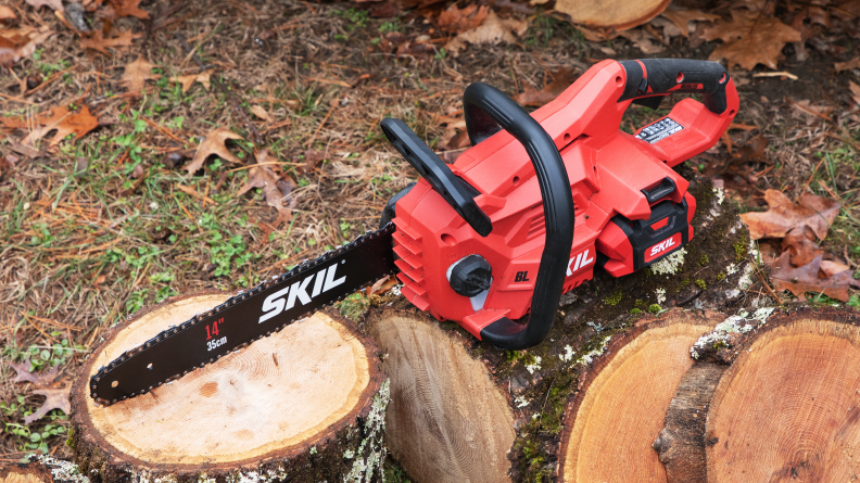 A Skil Chainsaw appears next to a log.