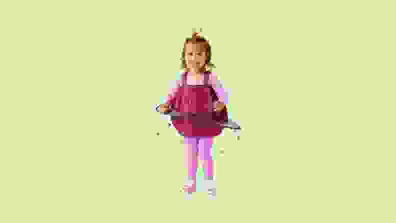 A child wearing a pink planet costume.